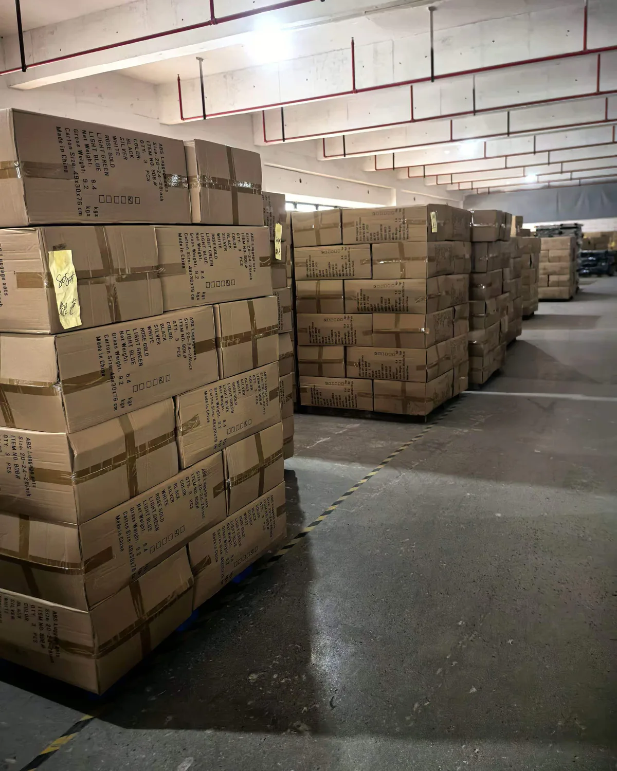 Cartons of finished luggage sets in the factory warehouse