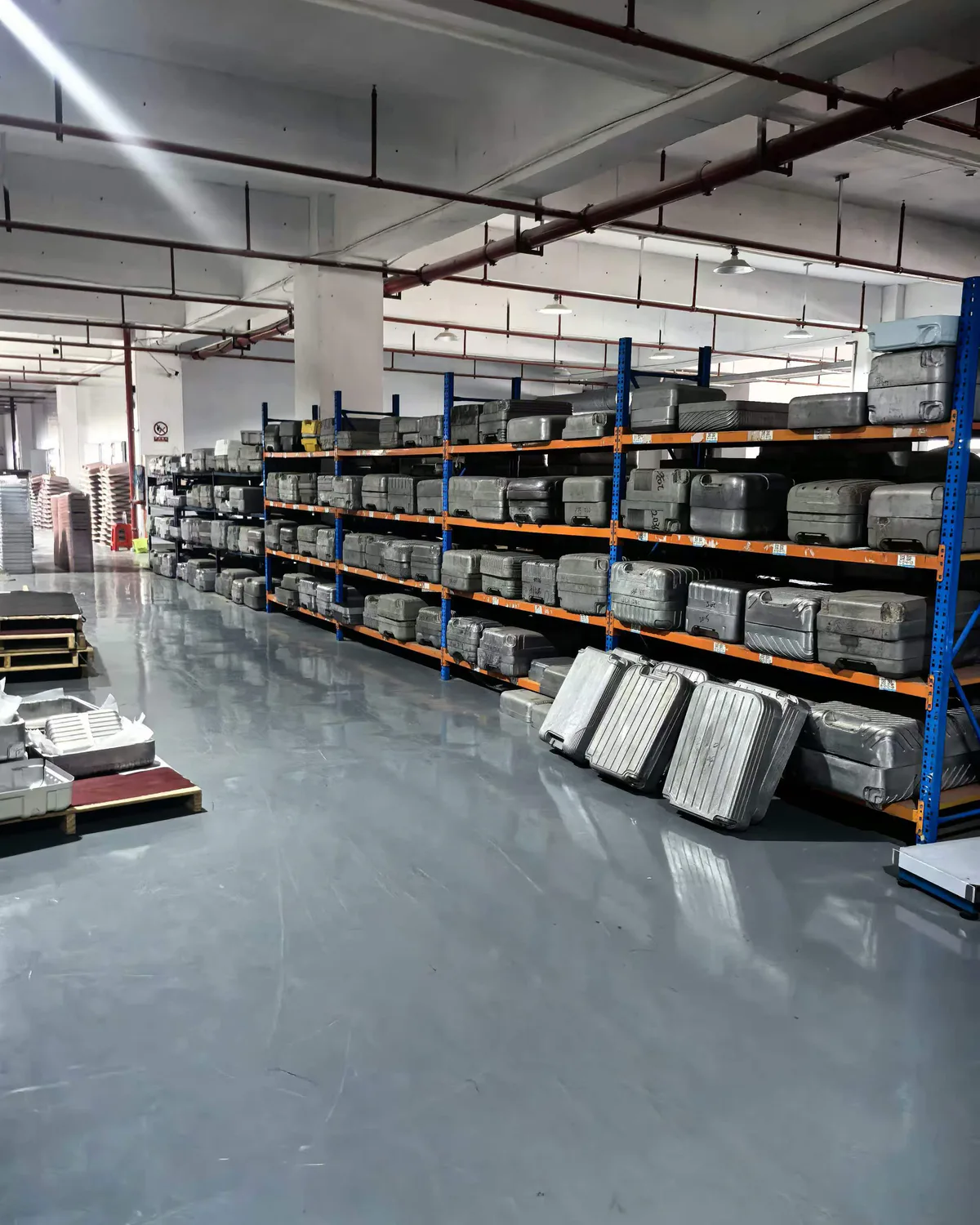 Luggage shell moulds stored on factory racks